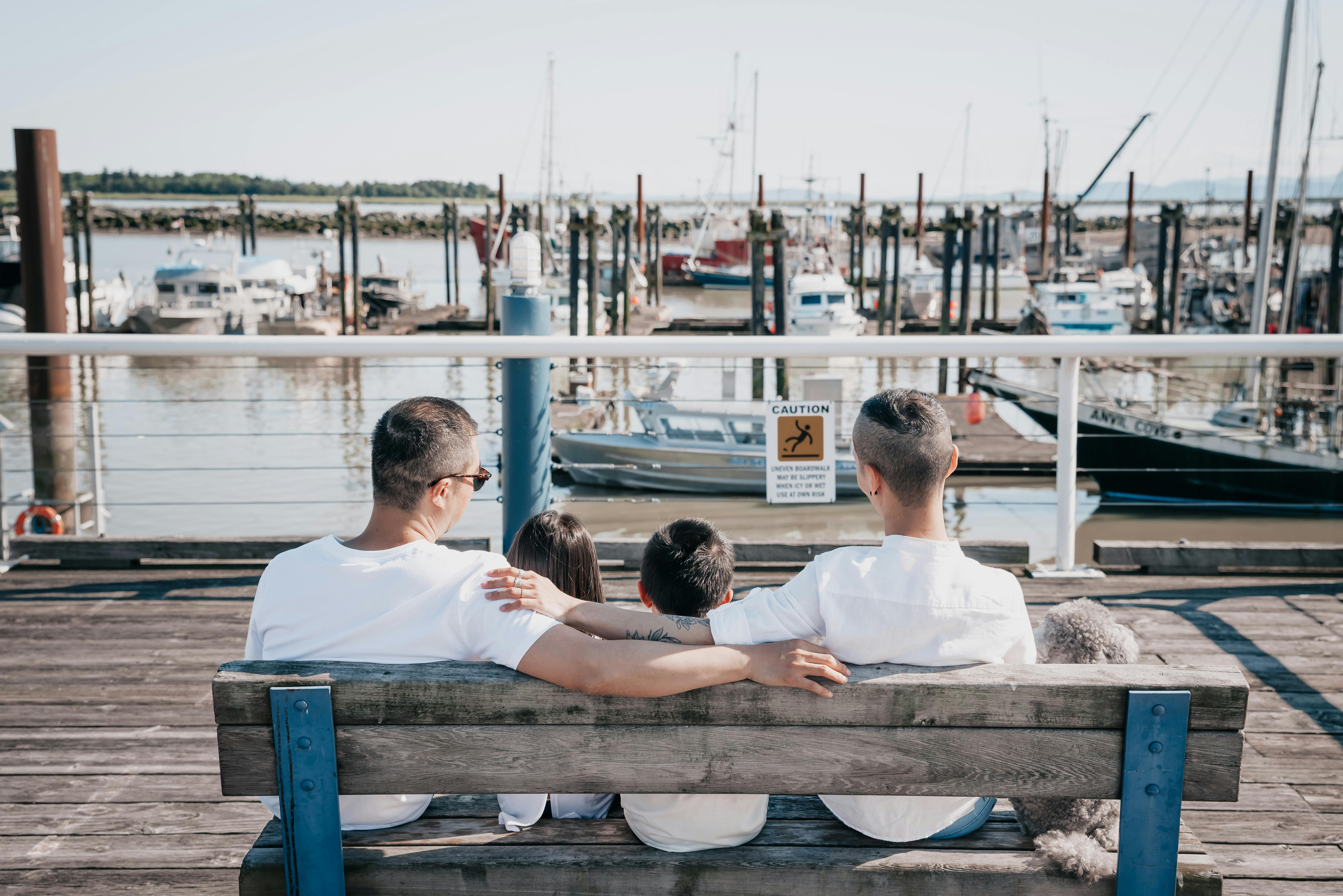 Picture of parents with children sitting on a bench